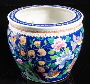 A Chinese blue-ground famille rose jardiniere