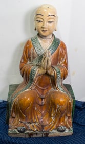 A Chinese sancai glazed figure of a Buddhist monk