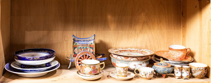 A shelf of Japanese decorative ceramic objects