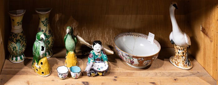 A shelf of Asian decorative items