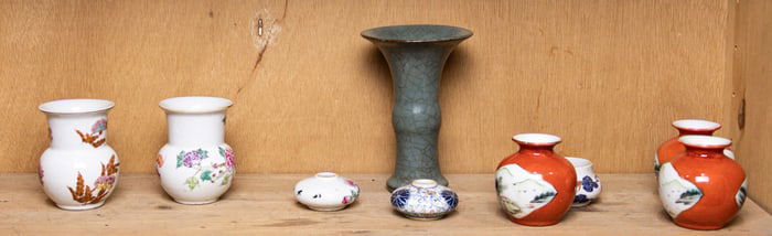 A shelf of Chinese ceramic objects