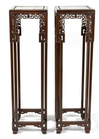 A pair of Chinese rosewood square planter stands