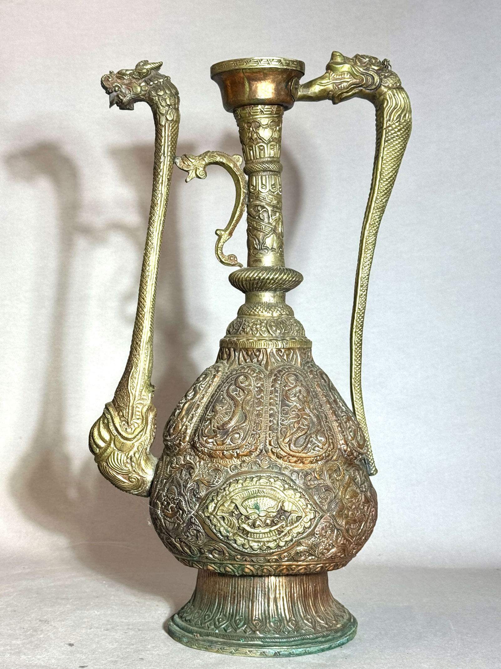 Tibetan Antique Copper Ewer with Dragon Spout: Tibetan Antique copper repouss ritual ewer of dragon spout, missing cover. 20" (50.8 cm) NOTE: THIS ITEM IS IN NEW YORK, WHERE IT CAN BE SHIPPED FROM.