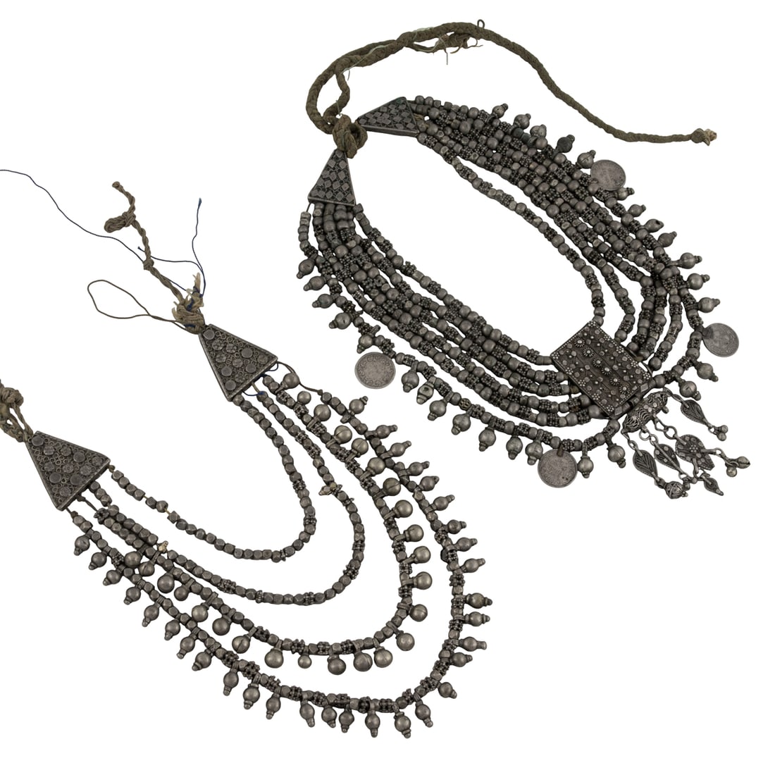 (lot of 2) Yemenite silver and white metal necklaces: (lot of 2) Yemenite silver and white metal necklaces. 10.5" and 14" long, 518 grams. Provenance: Naomi Lindstrom collection.