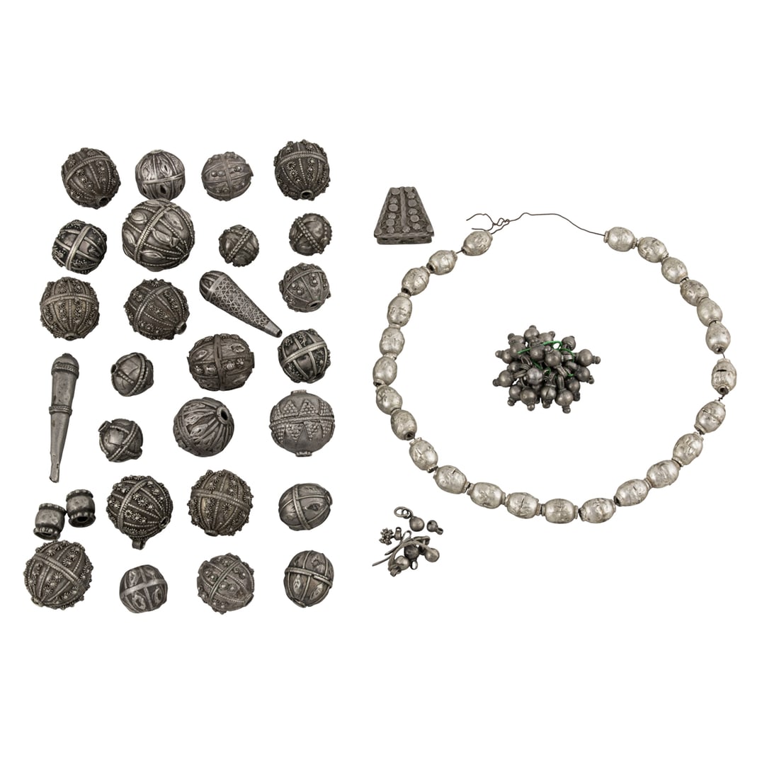 A group of Yemenite and Ethiopian silver beads: A group of Yemenite and Ethiopian silver beads. From 0.25" to 1.5" across, 310 grams. Provenance: Naomi Lindstrom collection.