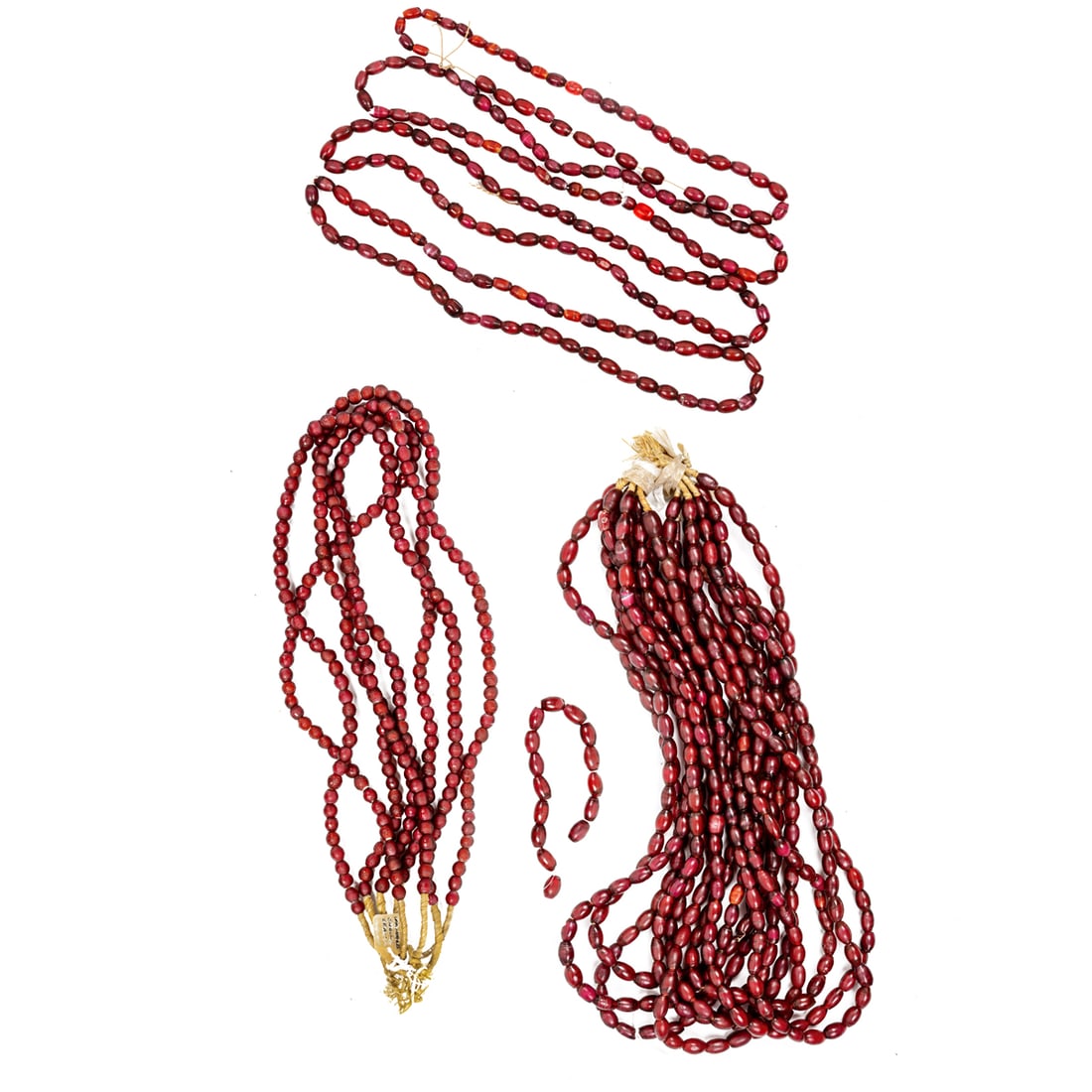 A group of Venetian red glass beads: A group of Venetian red glass beads. From 0.25" to 0.5" across. Provenance: Naomi Lindstrom collection.