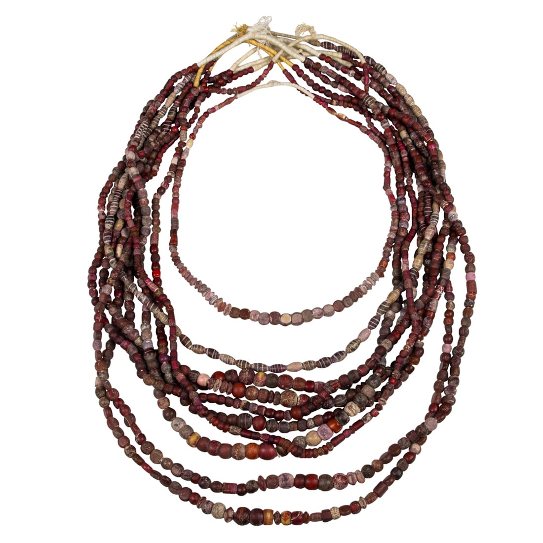 A group of Venetian overlay glass beads: A group of Venetian overlay glass beads. Each bead from 0.25" to 0.875" across. Provenance: Naomi Lindstrom collection.