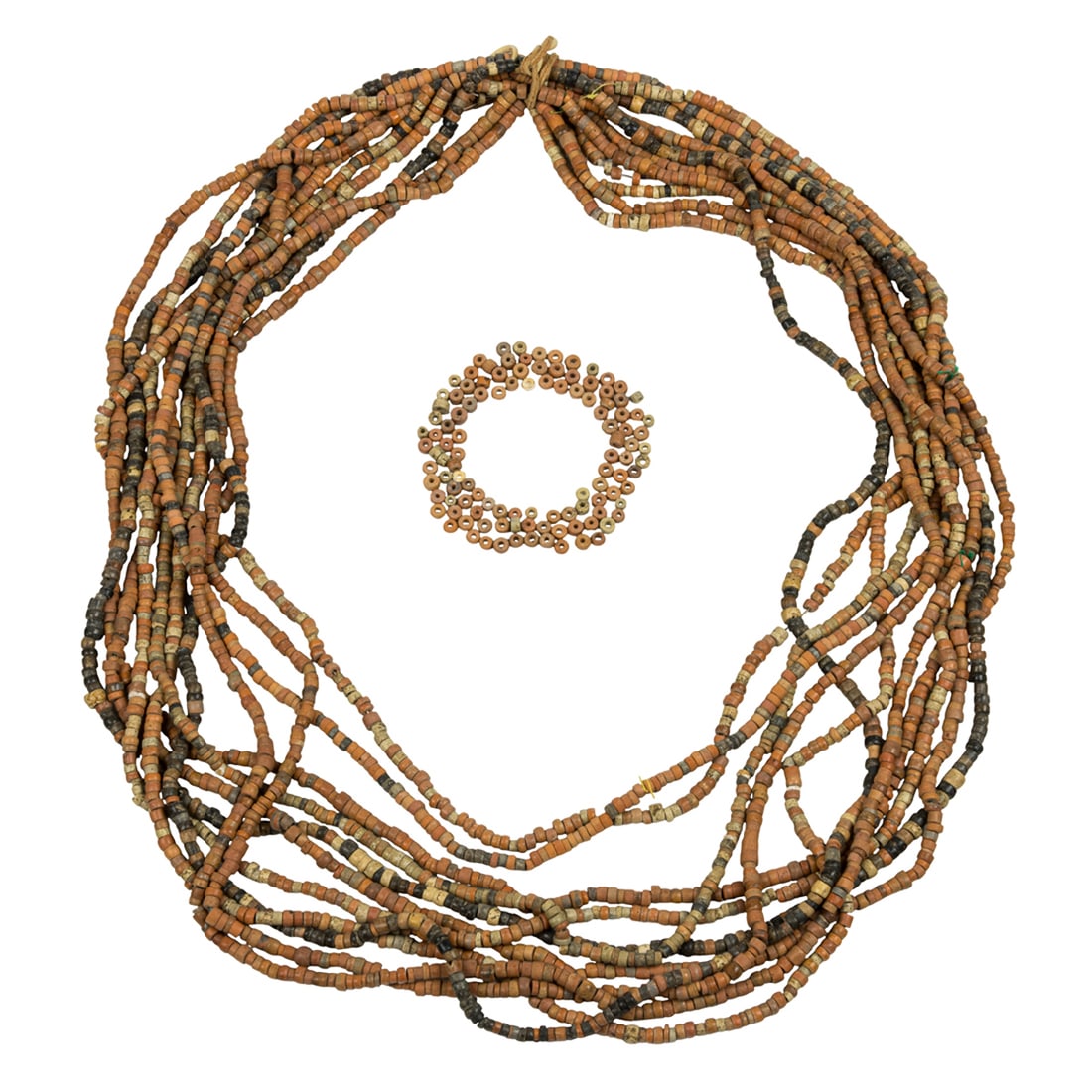 Eleven strands of Pre-Columbian lime beads: Eleven strands of Pre-Columbian lime beads. From 0.125" to 0.25" across, 32" long. Provenance: Naomi Lindstrom collection.