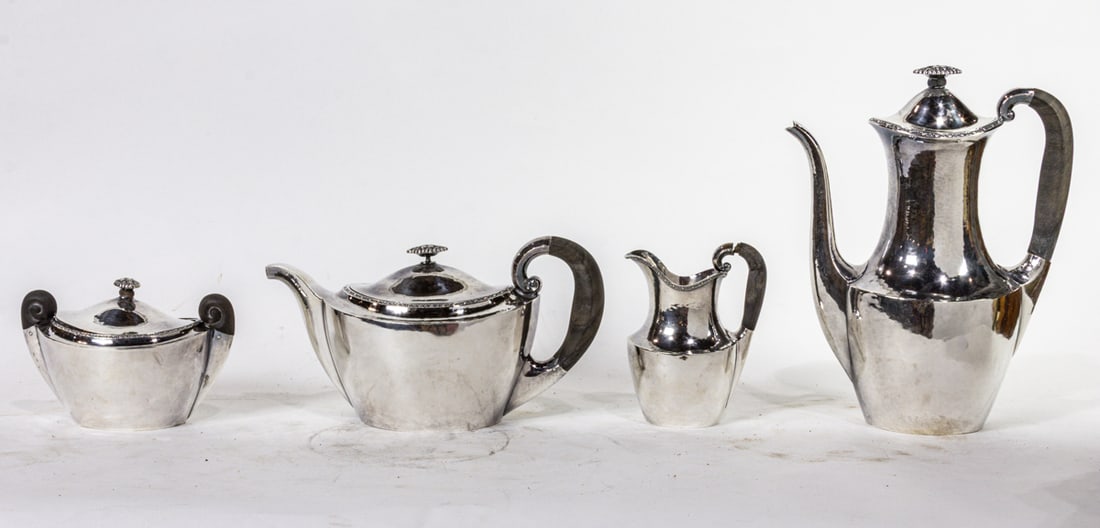 A four piece Art Deco Bruckmann & Sohne 800-silver tea and coffee service: A four piece Art Deco Bruckmann & Sohne 800-silver tea and coffee service, comprising (1) coffee pot, 10.75" h; (1) tea pot, 6" h; (1) covered sugar, 4" h; (1) creamer, 5"h. 52.06 troy oz including ha