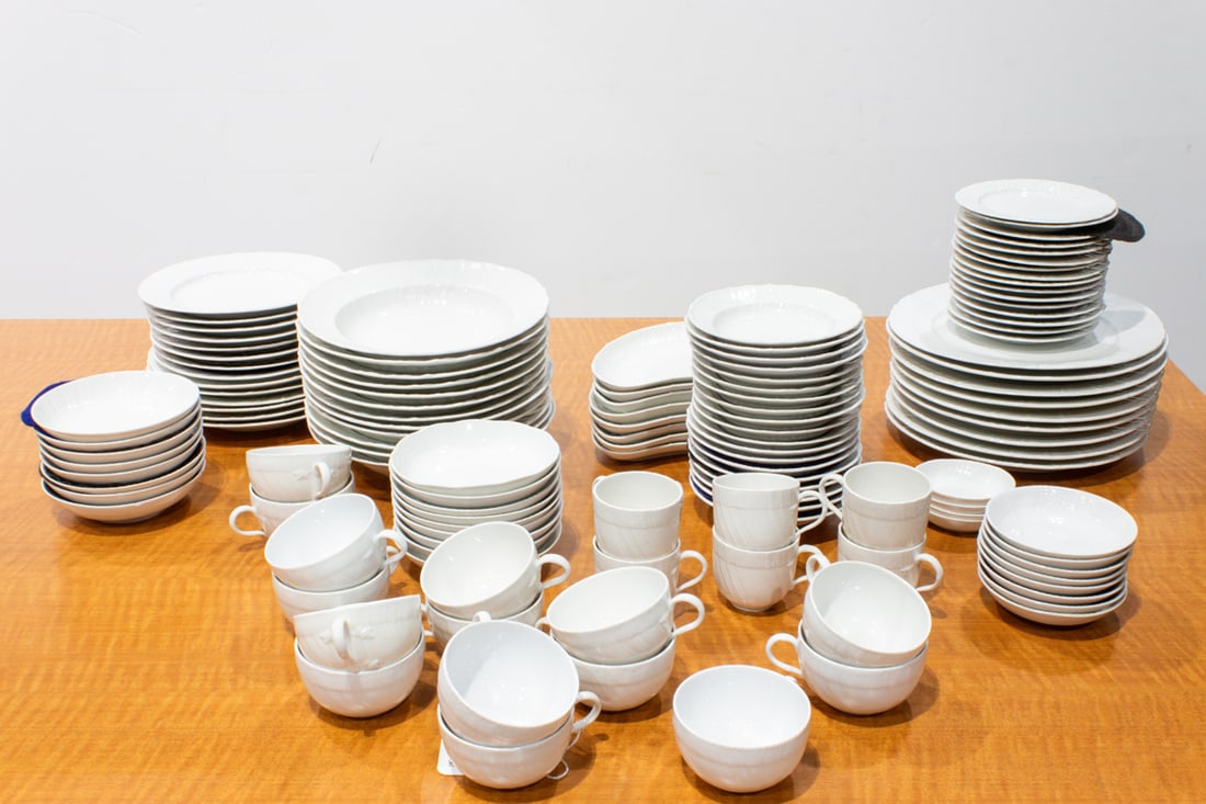 A Berlin (KPM) porcelain dinner service in the Neuosier pattern: A Berlin (KPM) porcelain dinner service in the Neuosier pattern, each relief decorated with basket weave borders, comprising (9) dinner plates, 10.25"dia; (6) plates, 8.5"dia; (8) plates, 8"dia; (16)