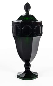 A Continental emerald green glass covered jar or pokal in the manner of Wiener Werkstatte Josef