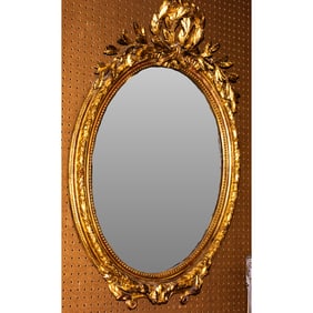 A Napoleon III giltwood mirror with beveled mirrored glass