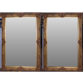 A pair of Classical style giltwood mirrors