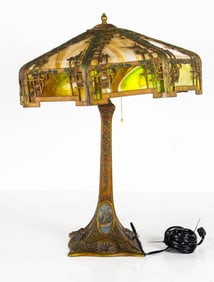 An American Arts & Crafts patinated metal and slag glass table lamp