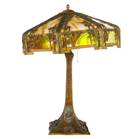 An American Arts & Crafts patinated metal and slag glass table lamp