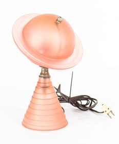 An Art Deco pink glass Saturn table lamp designed for the 1939 World's Fair