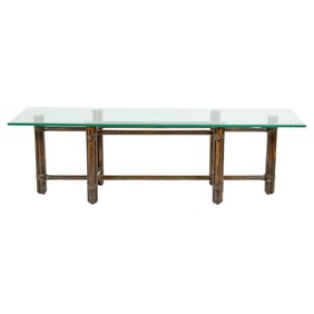 A McGuire rattan and glass top low table