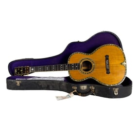 A Washburn Style 308 acoustic guitar