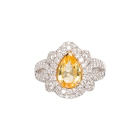An Oscar Friedman yellow sapphire, diamond, and platinum ring