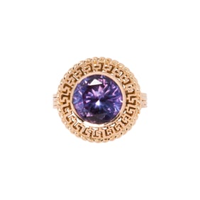 A synthetic color change sapphire and 14k gold ring