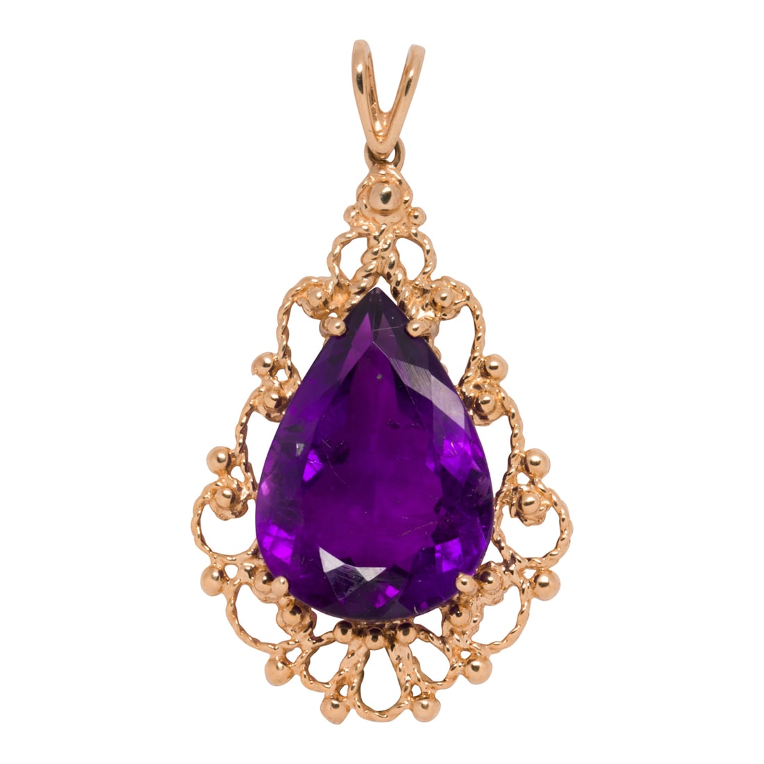An amethyst and 14k gold pendant: An amethyst and 14k gold pendantDesigned with a pear-cut amethyst measuring approximately 18.15 x 12.84 x 7.73 mm, framed by ornate filigree; pendant length: 1 1/2 in; 4.35 grams