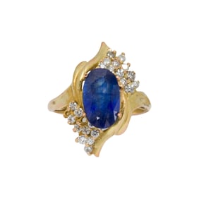 A sapphire, diamond, and 14k gold ring