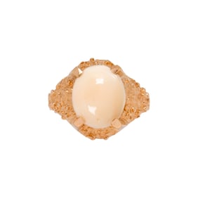 A coral and 14k gold ring