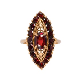 A garnet and 14k gold ring