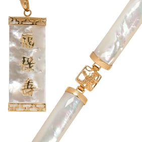 A mother-of-pearl and 14k gold pendant necklace and bracelet set