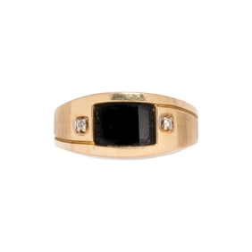 An onyx, diamond, and 14k gold ring