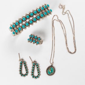A group of turquoise and sterling silver jewelry