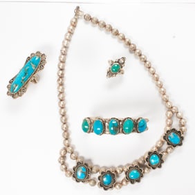 A group of turquoise and sterling silver jewelry