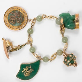 A jade and gold-tone charm bracelet