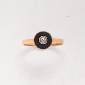 An onyx, diamond, and 14k gold ring