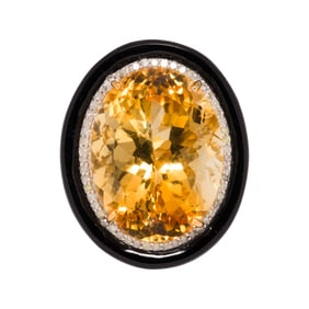 A citrine, diamond, onyx, silver, and 14k gold ring