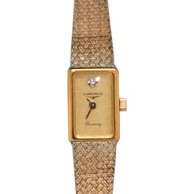 A gold-plated Longines watch
