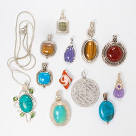 A group of hardstone and sterling silver pendants