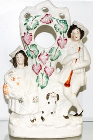A Staffordshire pottery pocket watch holder