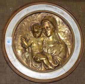 An Italian brass relief plaque of the Madonna and Child in frame