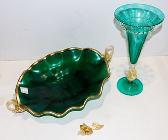A Murano green and gilt flecked glass trumpet vase with dolphin form stem