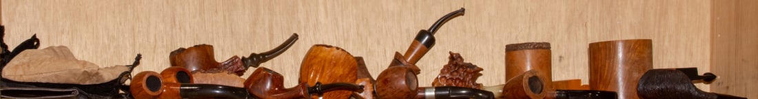 A group of twleve briar wood pipes: A group of twleve briar wood pipes, including two by Mario Grandi, greatest 7.5"l