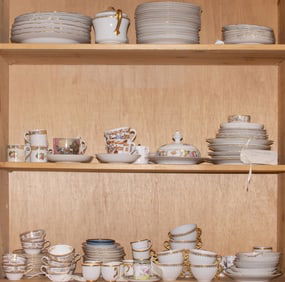 A large group of porcelain plates, cups and saucers