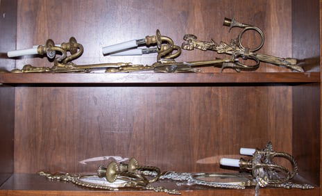 A group of five Neoclassical style brass wall sconces