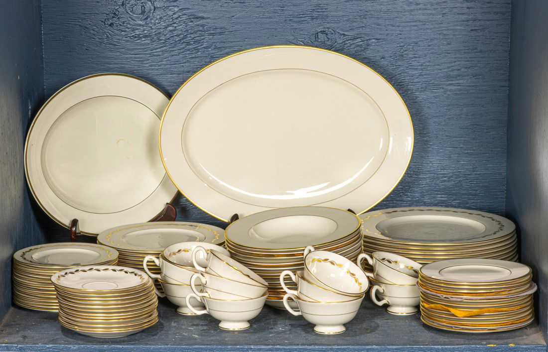 A Lenox porcelain assembled dinner service in the Golden Wreath and Mansfield patterns: A Lenox porcelain assembled dinner service in the Golden Wreath and Mansfield patterns, each decorated with gilt on an ivory ground, comprising in the Golden Wreath pattern: (12) dinner plates, 10.5"