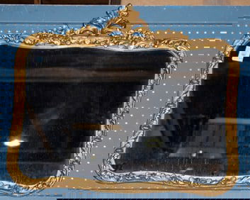 A Rococo style giltwood overmantle mirror