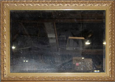 A Neoclassical style gilt wood mirror with rectangular beveled glass plate