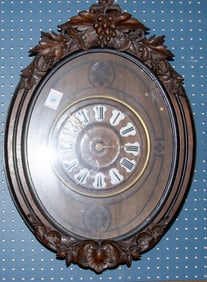 An oak wall clock, the dial having enamel roman numerals