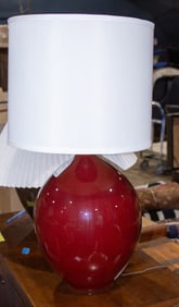 A Mid-Century Modern red glazed pottery table lamp