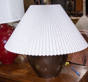 A stoneware jar mounted as a table lamp