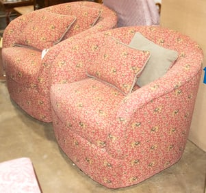 A pair of contemporary swivel barrel stools